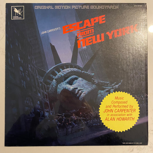 John Carpenter In Association With Alan Howarth - Escape From New York (Original Motion Picture Soundtrack) (LP, Album). ELECTRONIC